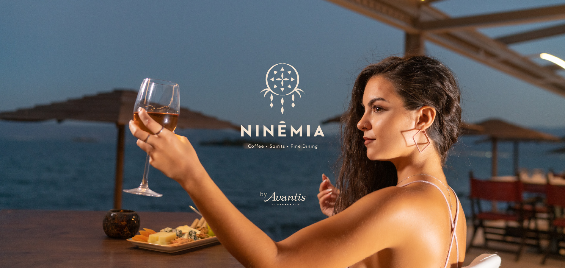Ninemia, coffee, sppirits, fine dining. Beautifull girl with glass of wine